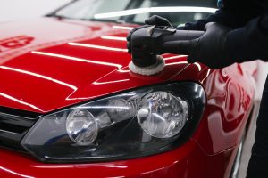 polishing a car while auto detailing