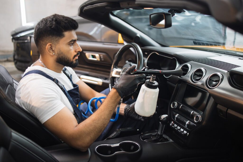 Using a Tornador to clean interior vehicle surfaces.